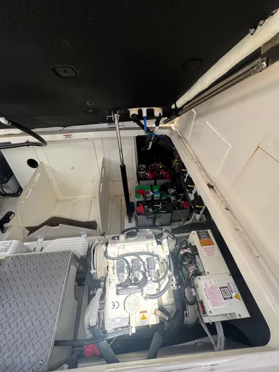  Yacht Photos Pics Engine compartment of 2021 Sea Ray Sundancer 320 Coupe Outboard, showcasing mechanical components.