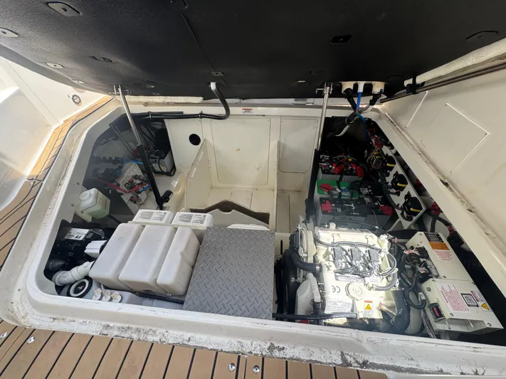  Yacht Photos Pics Engine compartment of 2021 Sea Ray Sundancer 320 Coupe Outboard, showcasing mechanical components.