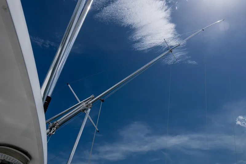 Adrian & Leidiana Yacht Photos Pics Antenna of 2005 Viking 61 yacht against a clear blue sky.