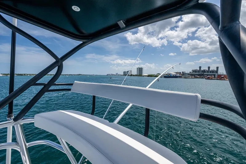 Adrian & Leidiana Yacht Photos Pics View from a 2005 Viking 61 yacht, overlooking a sunny waterfront cityscape.