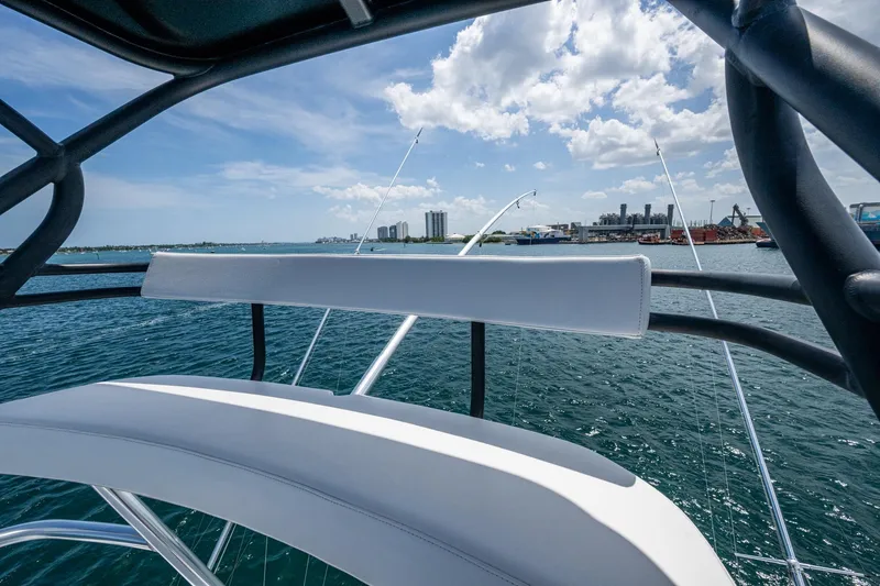Adrian & Leidiana Yacht Photos Pics 2005 Viking 61 yacht with ocean view and city skyline in the background.