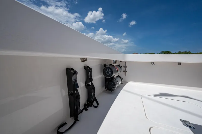 Adrian & Leidiana Yacht Photos Pics 2005 Viking 61 boat deck with storage and equipment under clear blue sky.