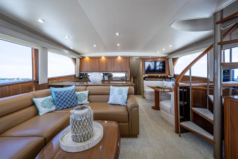 Adrian & Leidiana Yacht Photos Pics Luxurious interior of 2005 Viking 61 yacht with elegant seating and modern amenities.