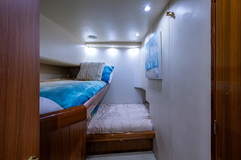 Adrian & Leidiana Yacht Photos Pics Cozy cabin interior with bunk beds in 2005 Viking 61 yacht.