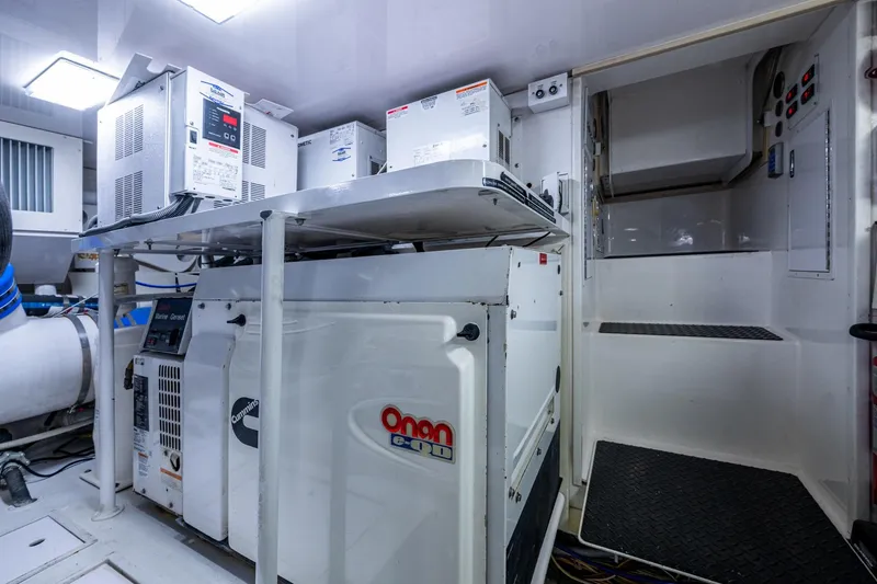 Adrian & Leidiana Yacht Photos Pics Engine room of 2005 Viking 61 yacht with Cummins Onan generator.