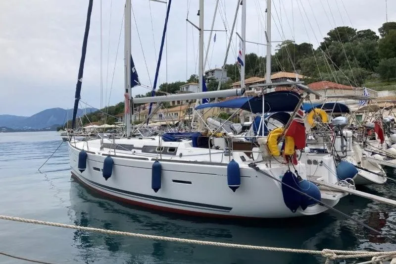Panopaea Yacht Photos Pics 2011 Dufour 405 GL sailboat docked in a scenic marina.