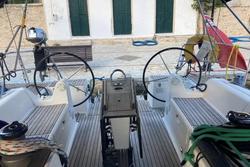 Panopaea Yacht Photos Pics Dufour 405 GL 2011 sailboat cockpit with dual steering wheels and teak decking.