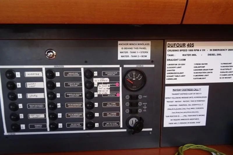 Panopaea Yacht Photos Pics Control panel of a 2011 Dufour 405 GL yacht with various switches and labels.