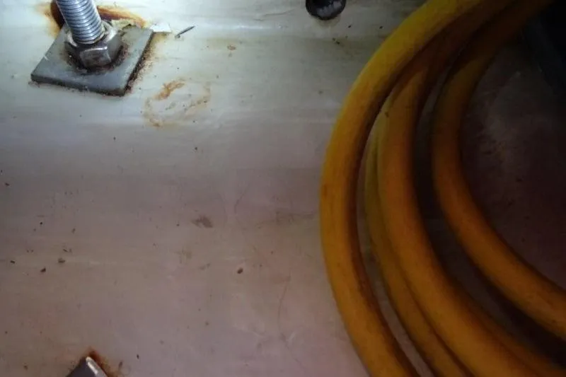 Panopaea Yacht Photos Pics Close-up of Dufour 405 GL 2011 boat interior with coiled yellow hose.