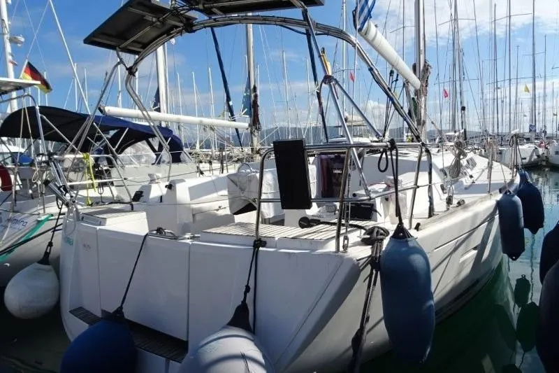 Panopaea Yacht Photos Pics 2011 Dufour 405 GL sailboat docked in a marina, surrounded by other boats.