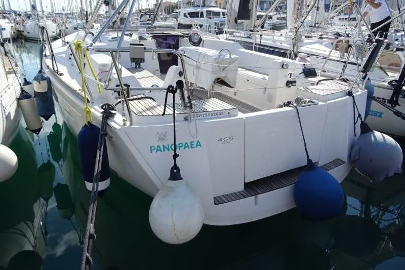 Panopaea Yacht Photos Pics 2011 Dufour 405 GL sailboat docked with fenders, rear view.