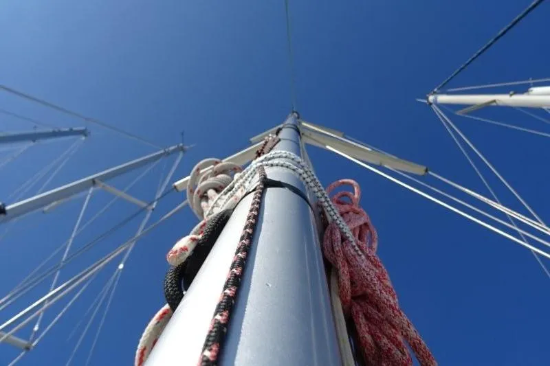 Panopaea Yacht Photos Pics Mast and rigging of 2011 Dufour 405 GL sailboat against clear blue sky.