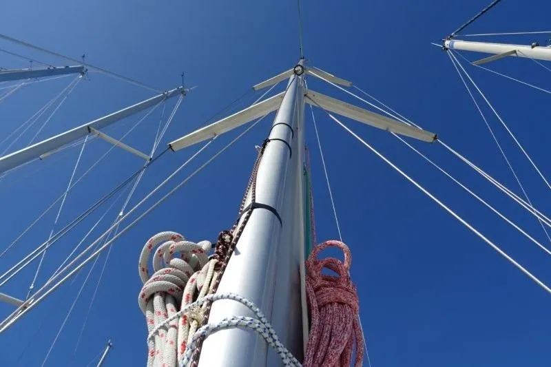 Panopaea Yacht Photos Pics Mast and rigging of 2011 Dufour 405 GL sailboat against clear blue sky.