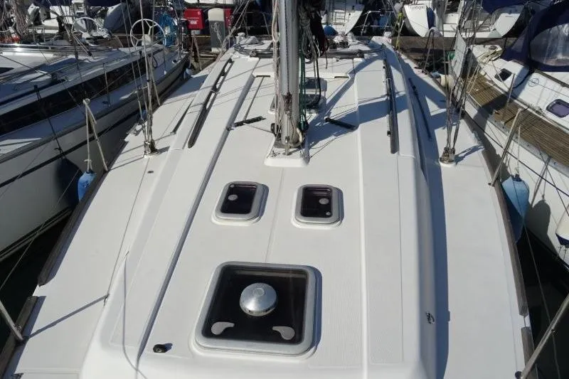 Panopaea Yacht Photos Pics 2011 Dufour 405 GL yacht deck view at marina, showcasing sleek design and hatches.