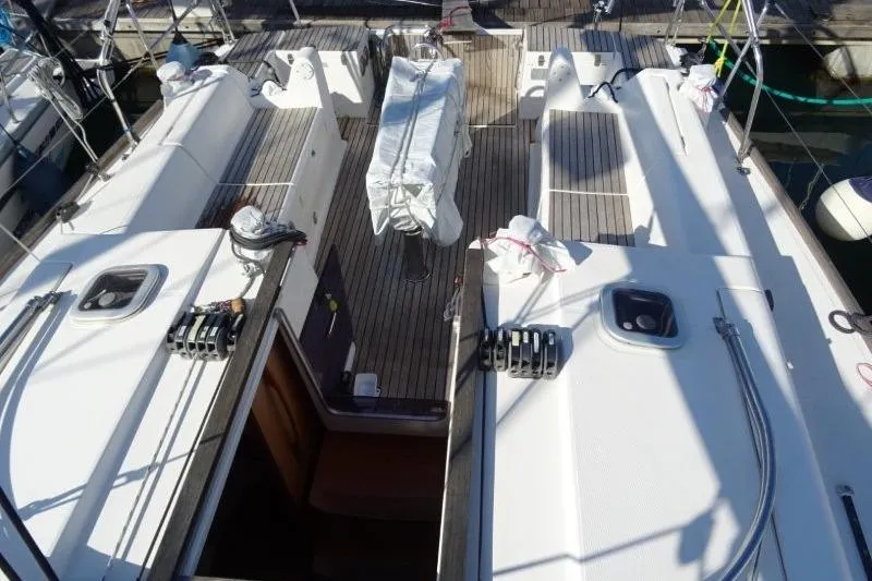 Panopaea Yacht Photos Pics 2011 Dufour 405 GL yacht deck with covered equipment and wooden flooring.