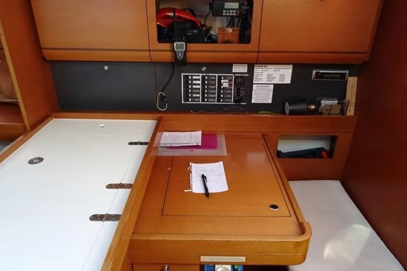 Panopaea Yacht Photos Pics Interior of 2011 Dufour 405 GL yacht with navigation station and control panel.