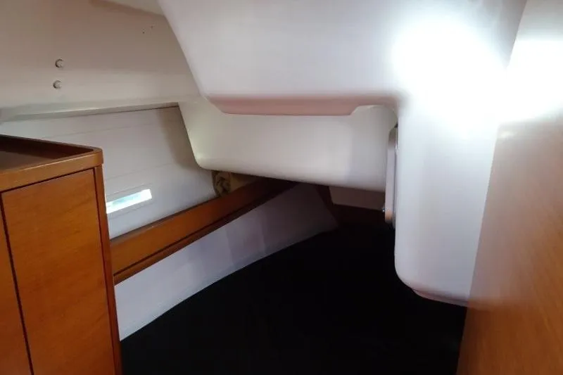 Panopaea Yacht Photos Pics 2011 Dufour 405 GL yacht interior cabin with wooden cabinetry and cozy sleeping area.