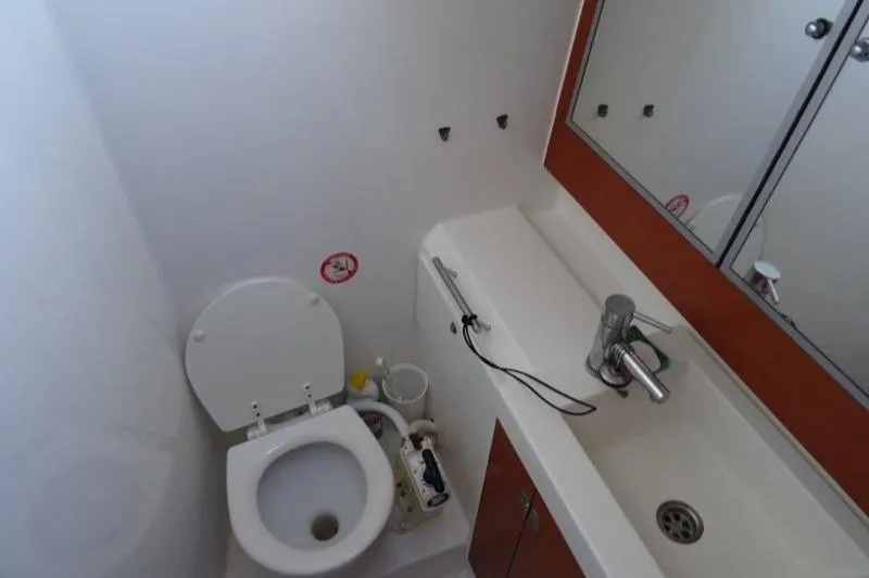 Panopaea Yacht Photos Pics Bathroom interior of 2011 Dufour 405 GL yacht with toilet and sink.