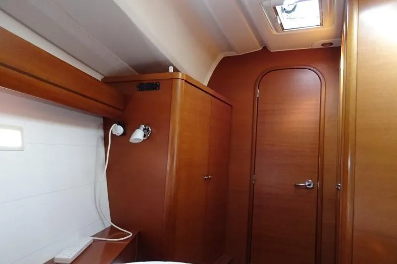 Panopaea Yacht Photos Pics Interior of 2011 Dufour 405 GL yacht with wooden cabinetry and ceiling hatch.