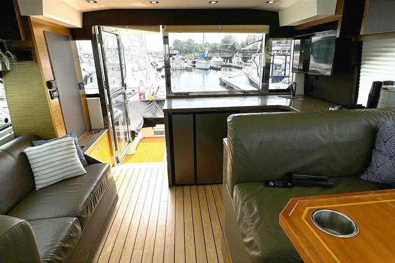  Yacht Photos Pics Luxurious interior of 2014 Cruisers Yachts 45 Cantius with marina view.