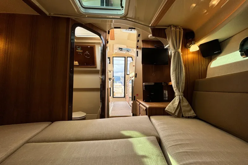  Yacht Photos Pics Interior of 2026 Ranger Tugs R-27 boat, featuring cozy seating and modern amenities.