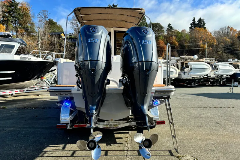  Yacht Photos Pics 2026 Ranger Tugs R-27 with dual Yamaha 150 outboard motors, docked outdoors.