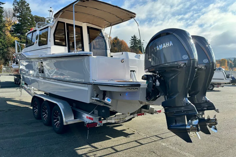  Yacht Photos Pics 2026 Ranger Tugs R-27 boat with dual Yamaha outboard motors on a trailer.