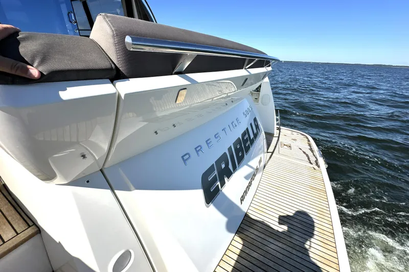 Eribella Yacht Photos Pics 2016 Prestige 500S yacht on water, rear view with deck and ocean backdrop.
