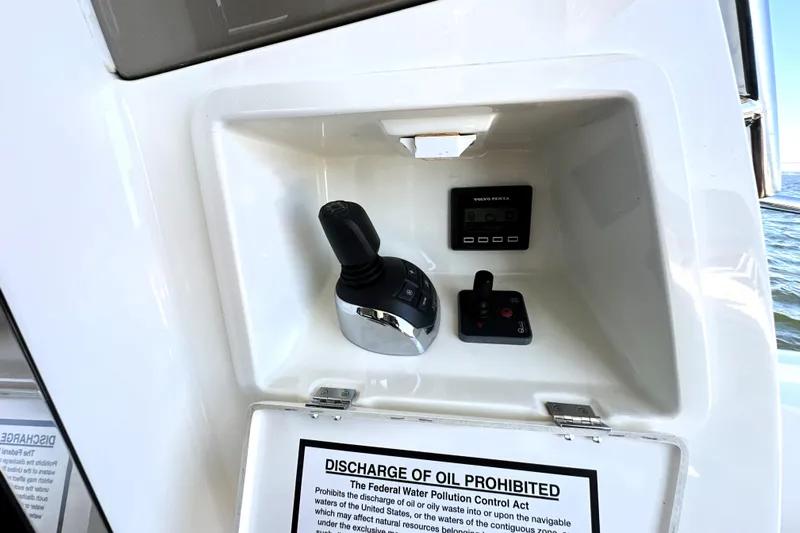 Eribella Yacht Photos Pics Control panel of a 2016 Prestige 500S yacht with joystick and display.