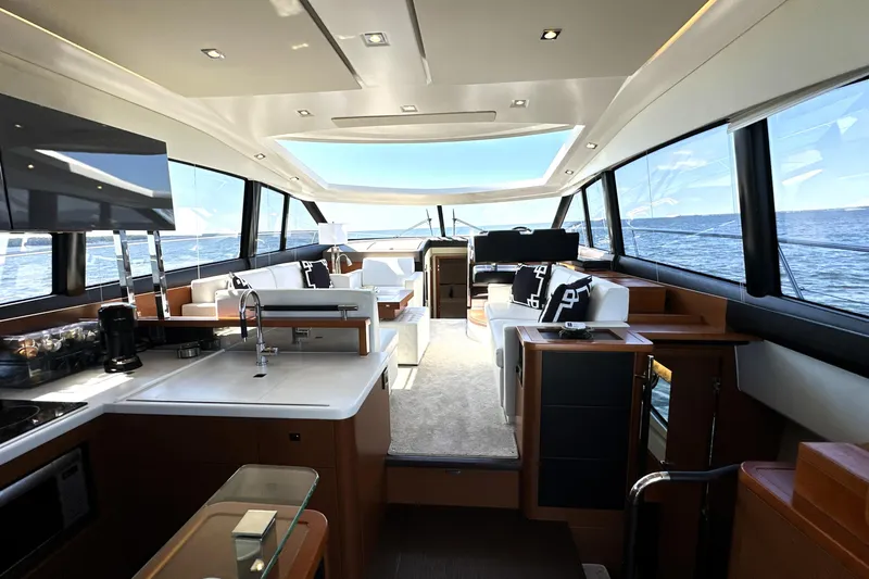 Eribella Yacht Photos Pics Luxurious interior of 2016 Prestige 500S yacht with modern furnishings and ocean view.