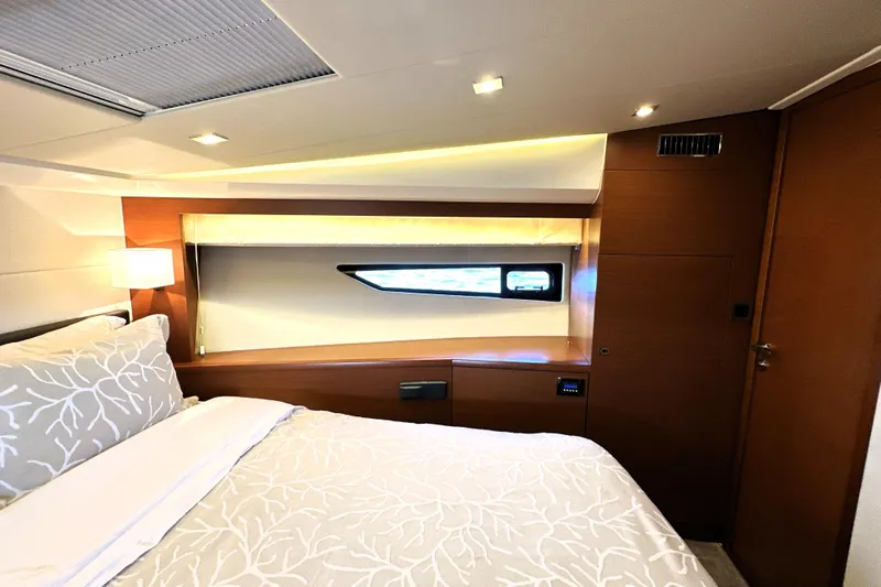 Eribella Yacht Photos Pics Luxurious bedroom interior of 2016 Prestige 500S yacht with modern design and elegant lighting.
