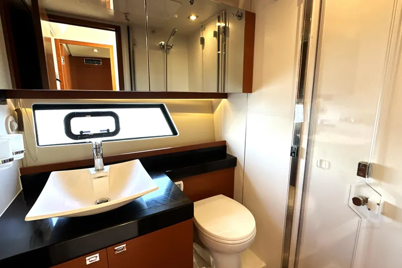 Eribella Yacht Photos Pics Luxurious bathroom in 2016 Prestige 500S yacht with modern fixtures and elegant design.