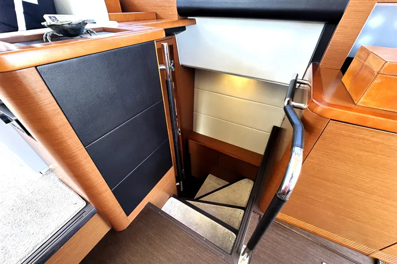 Eribella Yacht Photos Pics Staircase inside 2016 Prestige 500S yacht with modern wood and leather design.