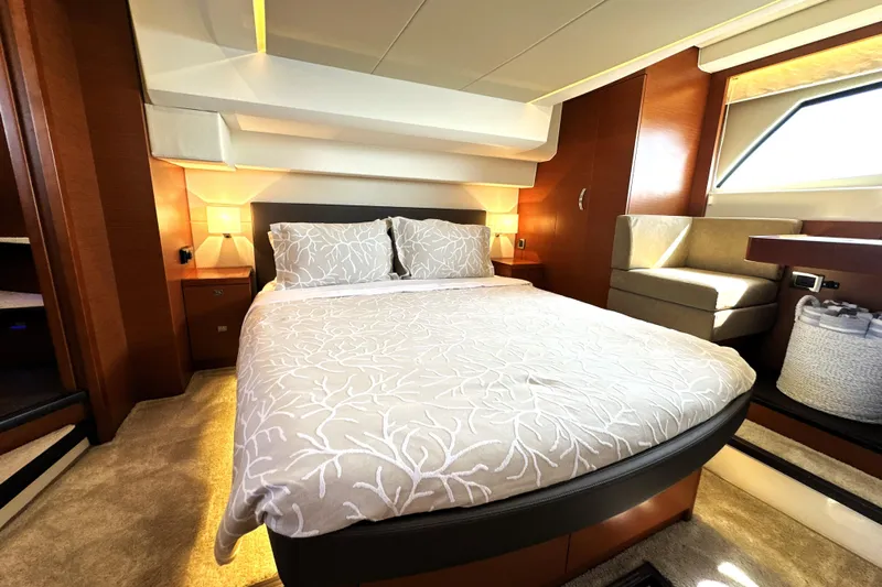 Eribella Yacht Photos Pics Luxurious bedroom interior of 2016 Prestige 500S yacht with elegant bedding and modern design.