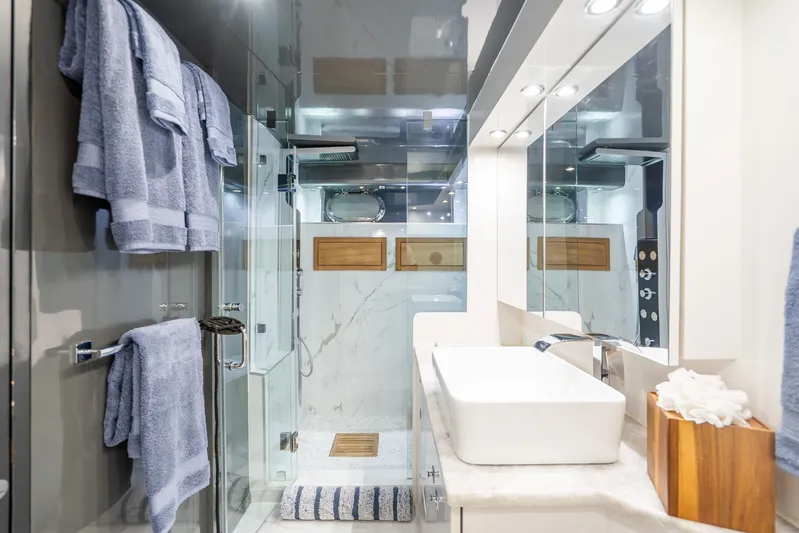 Azure Yacht Photos Pics Luxurious bathroom on a 1991 Maiora flybridge yacht with modern fixtures and elegant design.