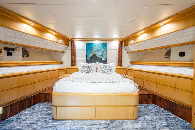 Azure Yacht Photos Pics Luxurious 1991 Maiora flybridge yacht bedroom with elegant wood finishes and modern decor.