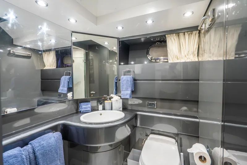 Azure Yacht Photos Pics Luxurious bathroom in 1991 Maiora flybridge yacht with modern fixtures and elegant design.