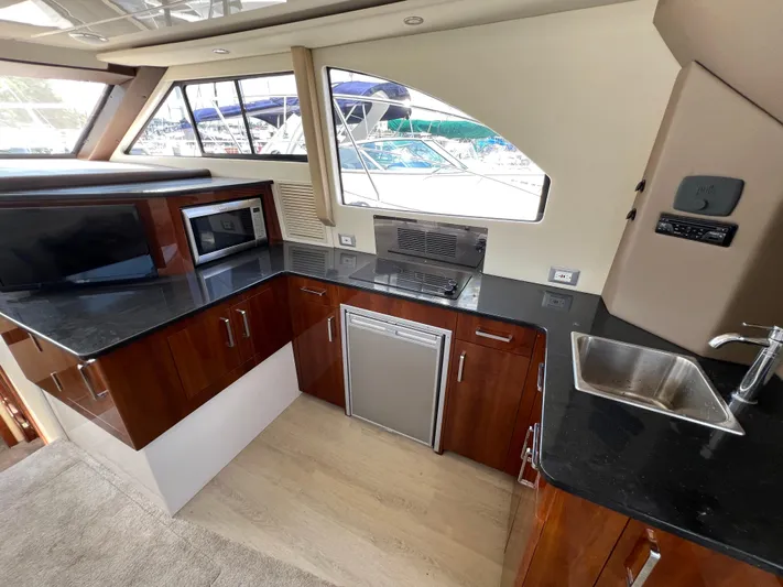 Melody Rose Yacht Photos Pics Luxurious 2016 Carver C34 Command Bridge yacht kitchen with modern appliances and sleek design.