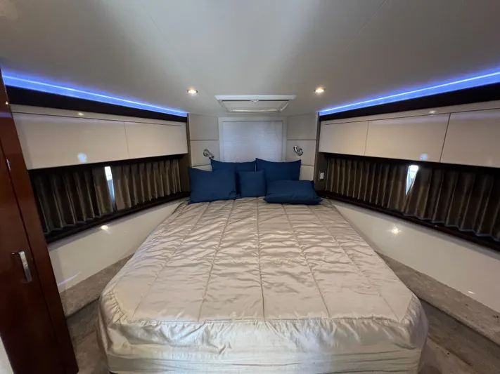 Melody Rose Yacht Photos Pics Luxurious bedroom interior of 2016 Carver C34 Command Bridge yacht with elegant bedding.