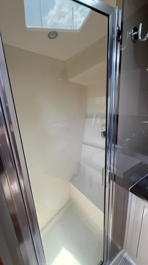 Melody Rose Yacht Photos Pics Shower area in 2016 Carver C34 Command Bridge yacht with skylight.