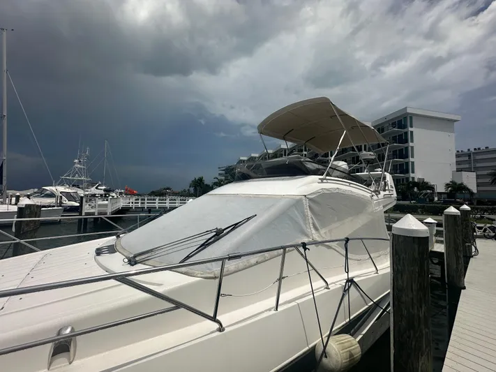 Knot Guilty Yacht Photos Pics 2016 Galeon 380 Fly yacht docked at marina under cloudy sky.