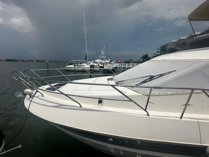 Knot Guilty Yacht Photos Pics Galeon 380 Fly yacht docked at marina, cloudy sky, 2016 model.