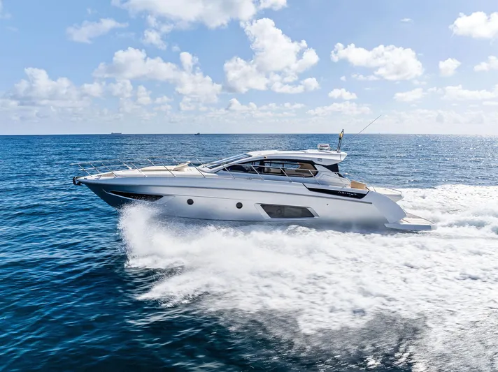 Manik Yacht Photos Pics Azimut Atlantis 50 yacht cruising on open sea, 2016 model, under clear blue sky.