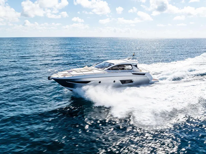 Manik Yacht Photos Pics Azimut Atlantis 50 yacht cruising on open sea, 2016 model, under clear skies.