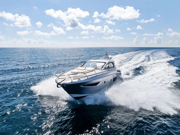Manik Yacht Photos Pics Azimut Atlantis 50 yacht cruising on open sea under clear blue sky, 2016 model.