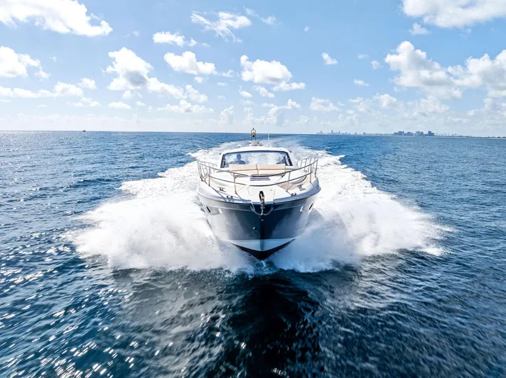 Manik Yacht Photos Pics Azimut Atlantis 50 yacht cruising on open sea, 2016 model, under clear blue sky.