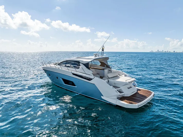 Manik Yacht Photos Pics Azimut Atlantis 50 yacht cruising on open sea, 2016 model, clear blue sky.