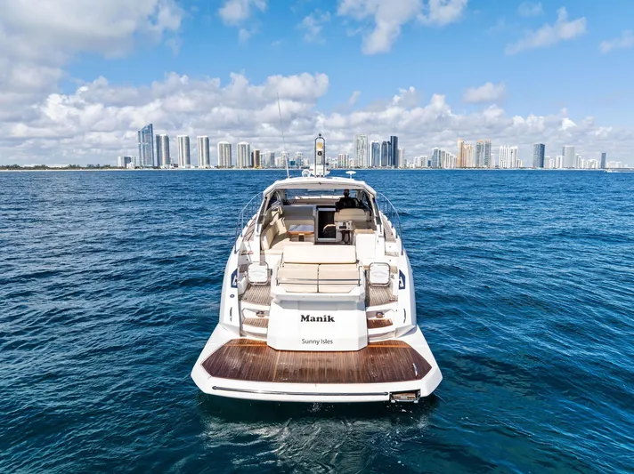 Manik Yacht Photos Pics Azimut Atlantis 50 yacht on ocean with city skyline, 2016 model.