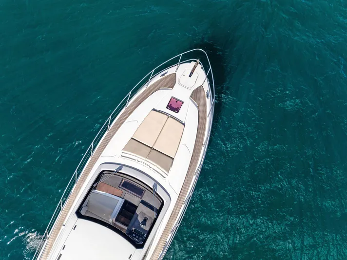 Manik Yacht Photos Pics Azimut Atlantis 50 yacht cruising on clear blue water, aerial view, 2016 model.