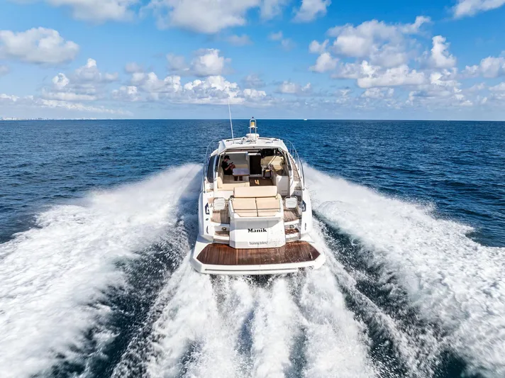 Manik Yacht Photos Pics Azimut Atlantis 50 yacht cruising on open sea, 2016 model, rear view.